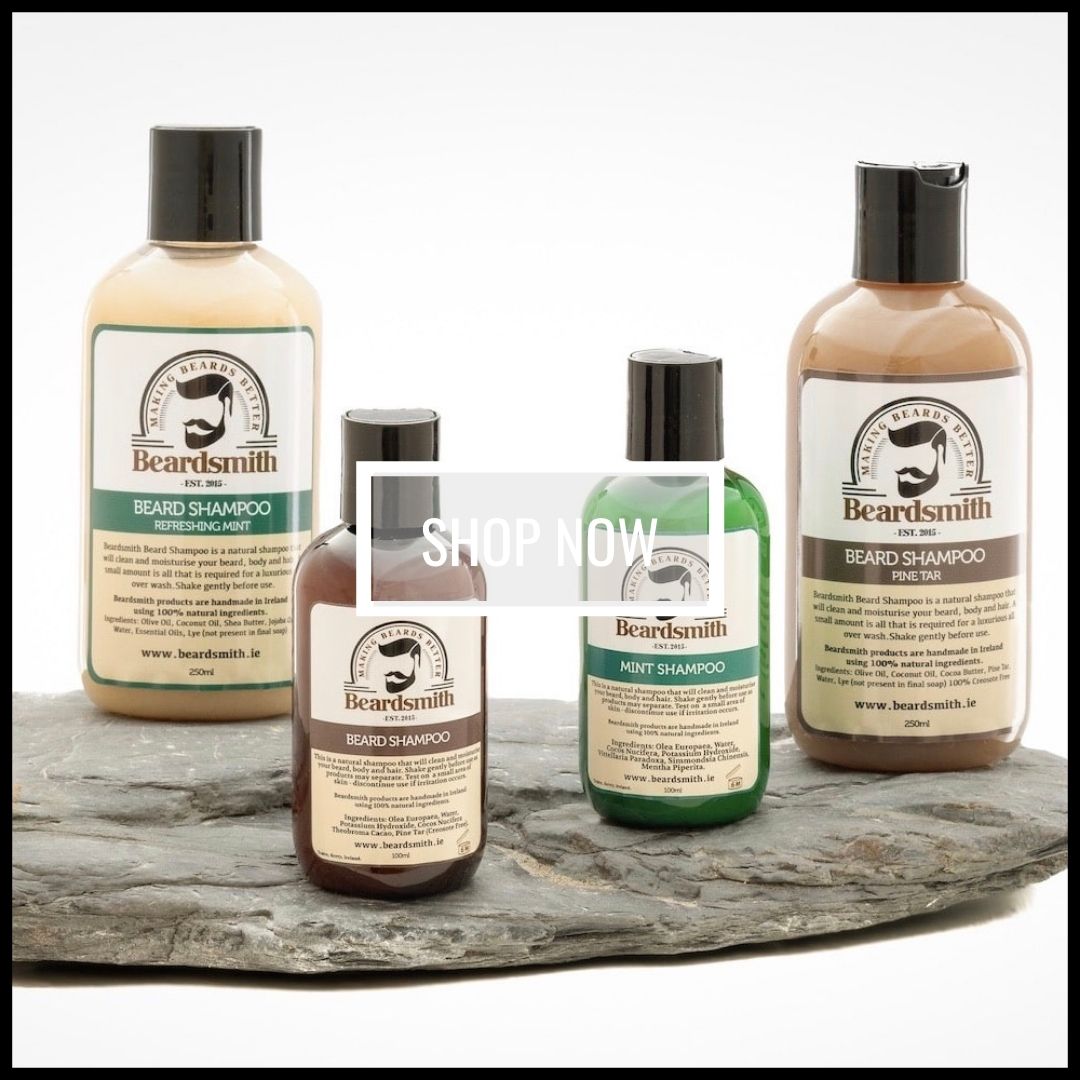 Bottles of Beardsmith beard shampoo displayed on a stone with a white background